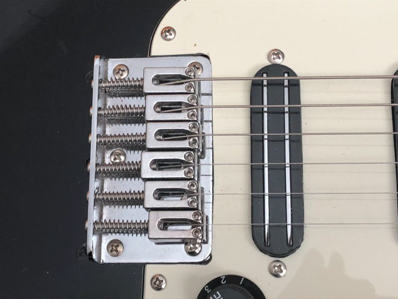 The Squire Bullet's hardtail bridge is moved forward and repositioned for a 24 inch scale length.