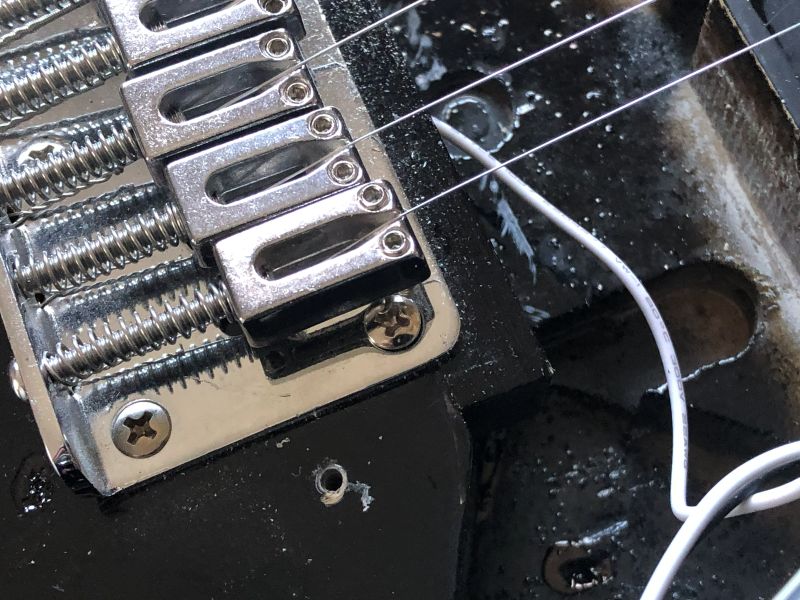 A piece of scrap wood was added to support the new bridge location.