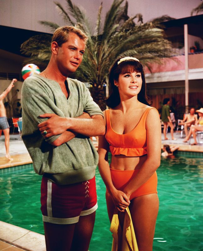 Stephanie Powers and Troy Donahue poolside in Palm Springs Weekend 1963