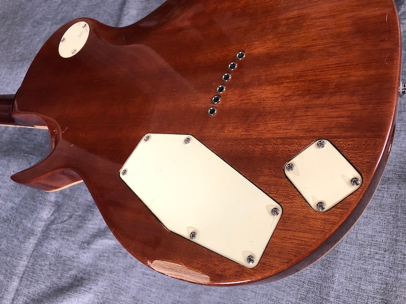 The extra cover plate (right) allows access to the unusual input jack placement.