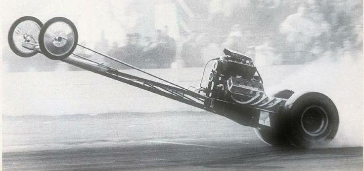 An early rail type dragster at liftoff